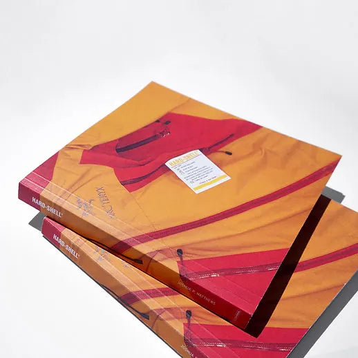 COMMA HARD-SHELL BOOK